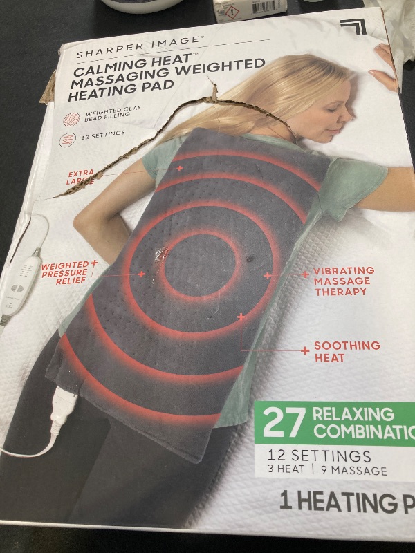 Photo 1 of Calming Heat Massaging Weighted Heating Pad by Sharper Image- Electric Heating Pad with Massaging Vibrations, Auto-Off,12 Settings- 3 Heat, 9 Massage- 27 Relaxing Combinations, 12” x 24”, 4lbs