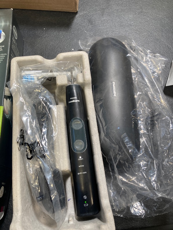 Photo 1 of Philips Sonicare ProtectiveClean 5300 Rechargeable Electric Toothbrush, with Pressure Sensor, 3 Cleaning Modes, SmarTimer and QuadPacer, with 2 Bonus Brush Heads, Travel Case, Black, Model HX6423/34