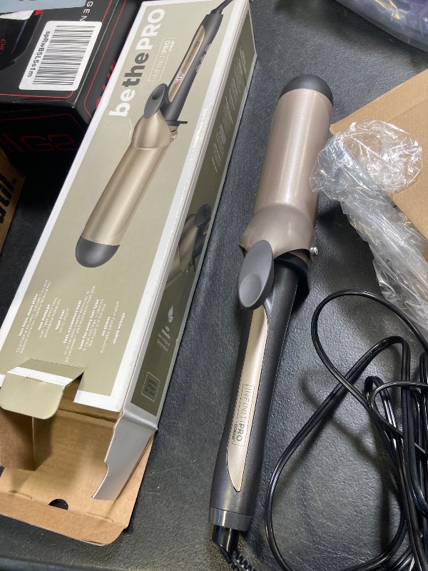 Photo 1 of INFINITIPRO BY CONAIR 1 3/4-inch Curling Iron, 1 3/4 inch barrel produces voluminous curls – for use on medium and long hair, CD1009