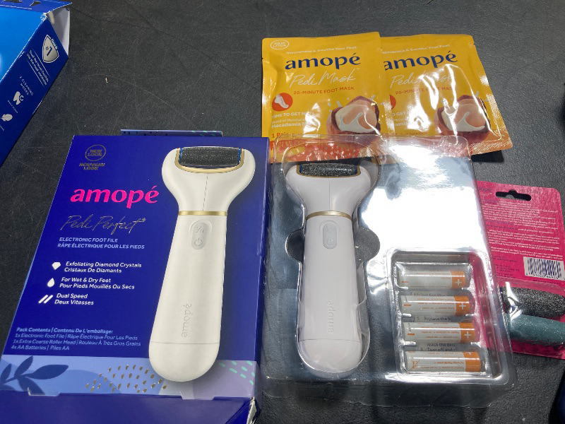 Photo 1 of Amopé Pedicure Value Kit, Spa Pampering Pack, Self-Care & Relaxation Gift, contains Pedi Perfect Electric Callus Remover Foot File, 2 Macadamia Oil PediMask Foot Masks, 2 Roller Heads – 4 pieces