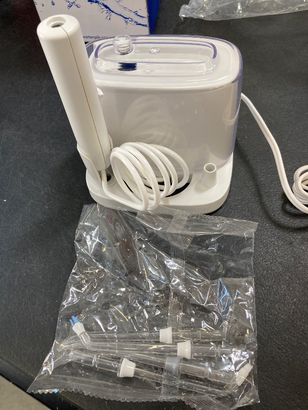 Photo 1 of Waterpik Nano Plus Water Flosser For Teeth, Portable Electric Power, Compact For Travel and Home, 4 Flossing Tips, ADA Accepted, White WP-320