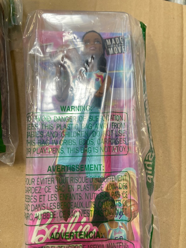 Photo 1 of Barbie Careers Fashion Doll & Accessories, Made to Move Brunette Basketball Player Wearing Removable Uniform with Ball, 22 Bendable Joints