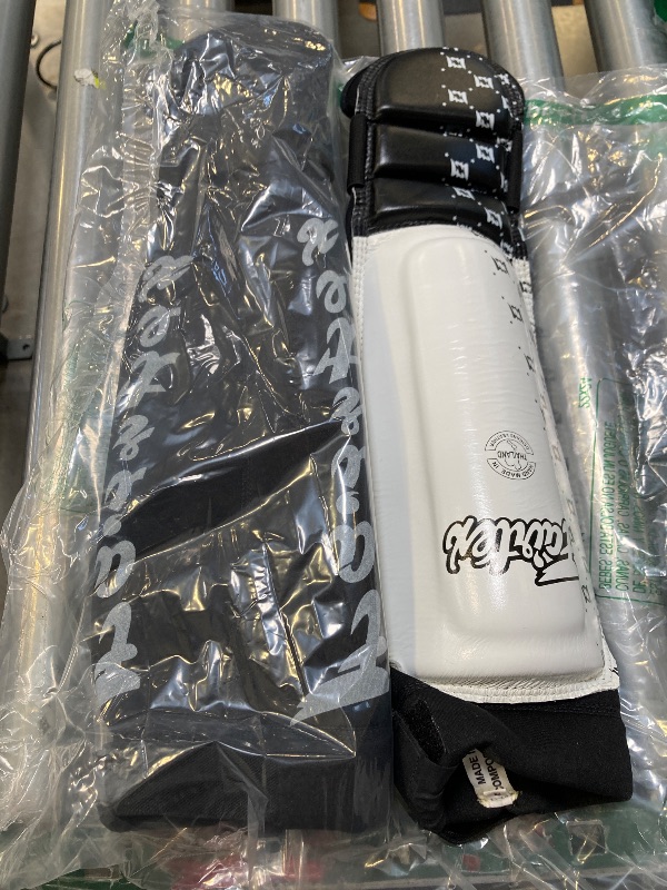 Photo 1 of Fairtex SP6 Muay Thai Shin Guards for Men, Women, Kids | Shin Guards Made with Neoprene Material & are Premium, Lightweight & Durable | Reinforced Paddings on The Shins (White/Black/Small)