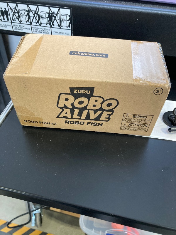 Photo 1 of Robo Alive Robo Fish Robotic Swimming Fish (Teal + Orange) by ZURU Water Activated, Changes Color, Comes with Batteries, Amazon Exclusive (2 Pack) Series 3