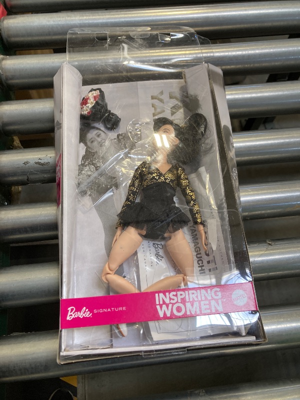 Photo 1 of Barbie Inspiring Women Doll, Kristi Yamaguchi Collectible in 1992 Winter Olympics Costume, Sparkly Black and Gold Leotard and White Skates