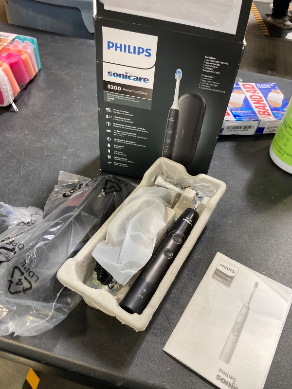 Photo 1 of Philips Sonicare ProtectiveClean 5300 Rechargeable Electric Toothbrush, with Pressure Sensor, 3 Cleaning Modes, SmarTimer and QuadPacer, with 2 Bonus Brush Heads, Travel Case, Black, Model HX6423/34
