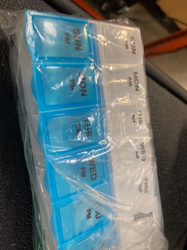 Photo 1 of Amazon Basic Care (7-Day) AM/PM Pill Organizer, Vitamin Case, And Medicine Box, Large Compartments, 2 Times a Day, Blue and Clear Lids