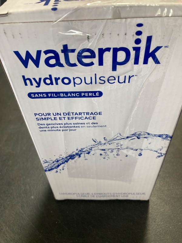 Photo 1 of Waterpik Cordless Pearl Rechargeable Portable Water Flosser for Teeth, Gums, Braces Care and Travel with 4 Flossing Tips - ADA Accepted, WF-13 White, Packaging May Vary
