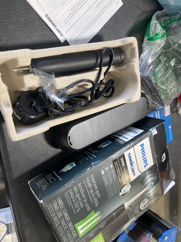 Photo 1 of Philips Sonicare ProtectiveClean 5300 Rechargeable Electric Toothbrush, with Pressure Sensor, 3 Cleaning Modes, SmarTimer and QuadPacer, with 2 Bonus Brush Heads, Travel Case, Black, Model HX6423/34