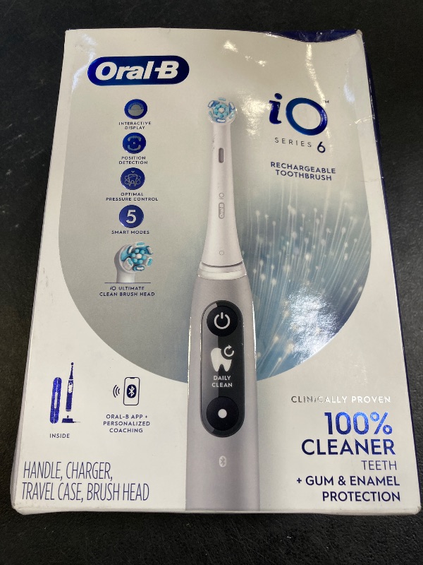 Photo 1 of Oral-B iO Series 6 Rechargeable Electric Toothbrush with Visible Pressure Sensor to Protect Gums, 2 Minute Timer, 5 Cleaning Settings, 1 Replacement Toothbrush Head, and Travel Case, Grey Opal