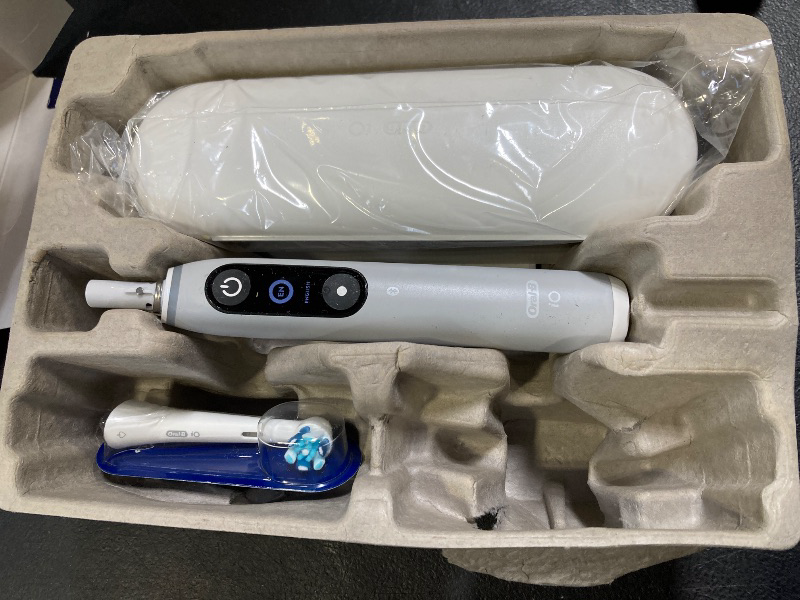 Photo 1 of Oral-B iO Series 6 Rechargeable Electric Toothbrush with Visible Pressure Sensor to Protect Gums, 2 Minute Timer, 5 Cleaning Settings, 1 Replacement Toothbrush Head, and Travel Case, Grey Opal