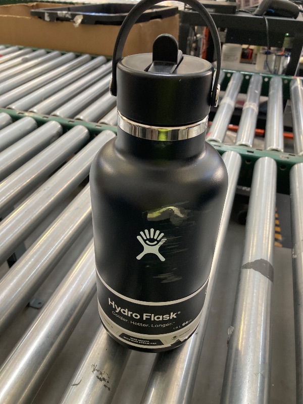 Photo 1 of Hydro Flask Water Bottle - Insulated Stainless Steel - Wide Straw Lid, Non Spill, Leakproof in 64 Oz Black
