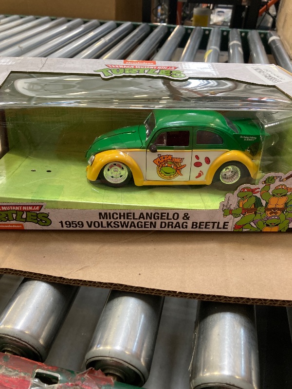 Photo 1 of Jada Teenage Mutant Ninja Turtles 1:24 1959 Volkswagen Drag Beetle Die-cast Car & 2.75" Michelangelo Figure, Toys for Kids and Adults (33741)