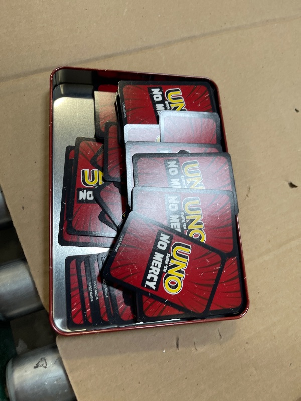 Photo 1 of Mattel Games UNO Show ‘em No Mercy Card Game in Storage & Travel Tin for Kids, Adults & Family Night with Extra Cards, Special Rules & Tougher Penalties (Amazon Exclusive)