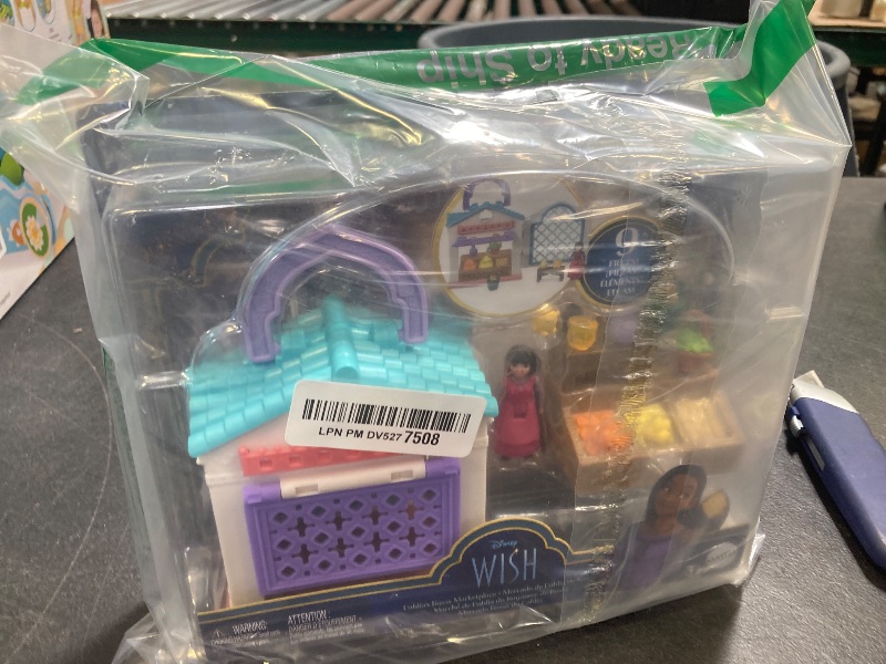 Photo 1 of Mattel Disney Wish Micro Doll Playset, Dahlia’s Rosas Marketplace Portable Set with Dahlia Doll, Star Figure & 9 Accessories, Travel Toy