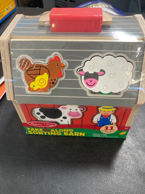 Photo 1 of Melissa & Doug Wooden Take-Along Barn Toy with Flip-Up Roof and Handle, 10 Farm Play Pieces, Shape Sorting And Stacking Learning Toys For Toddlers And Kids Ages 2+