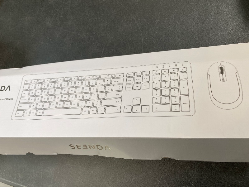 Photo 1 of Wireless Keyboard and Mouse Combo - Full Size Slim Thin Wireless Keyboard Mouse with Numeric Keypad 2.4G Stable Connection Adjustable DPI (White & Silver)