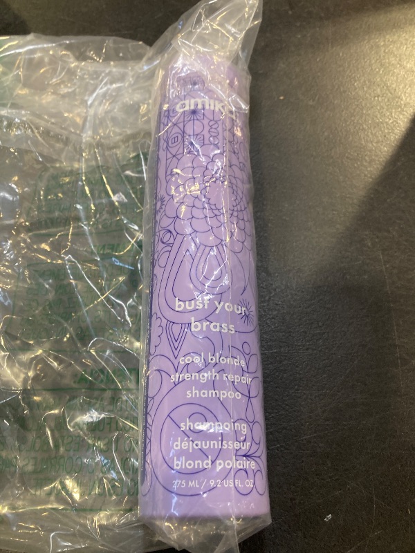 Photo 1 of amika bust your brass cool blonde strength repair shampoo, 275ml