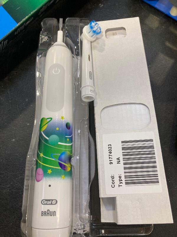 Photo 1 of Oral-B Kids Electric Toothbrush with Coaching Pressure Sensor and Timer, Rechargeable Toothbrush with Brush Heads, Galaxy