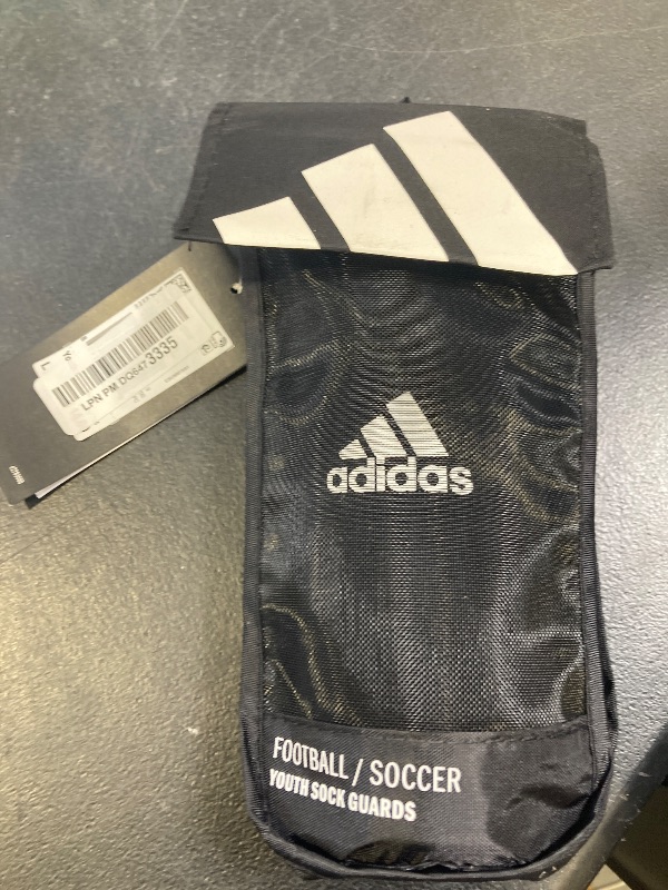 Photo 1 of adidas Unisex-Child Performance Youth Sock Shin Guards, Black/White, Large