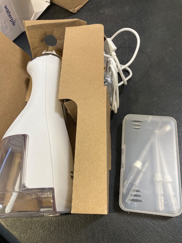 Photo 1 of Waterpik Cordless Advanced 2.0 Water Flosser For Teeth, Gums, Braces, Dental Care With Travel Bag and 4 Tips, ADA Accepted, Rechargeable, Portable, and Waterproof, Black WP-582, Packaging May Vary