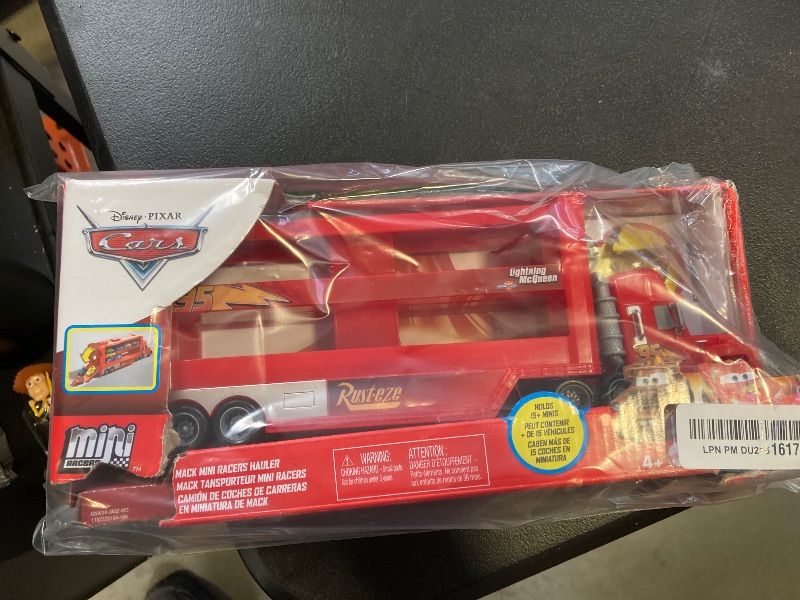 Photo 1 of Mattel Disney and Pixar Cars Mini Mack Racers Hauler & 1 Toy Car, Transporter Truck Holds 18 Minis, Collectible Set