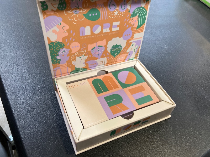 Photo 1 of Tell Me More: Family Edition - A Family Conversation Starter Game of 52 Questions to Foster Communication and Deepen Connections