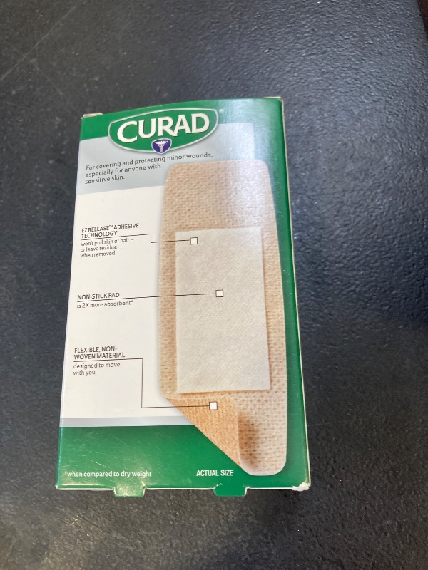 Photo 1 of CURAD Truly Ouchless, Extra Large Silicone Bandages, 1.65"" x 4"", For Sensitive or Delicate Skin, Flexible Fabric, Protects Scrapes, Cuts & Burns, 5 Count
