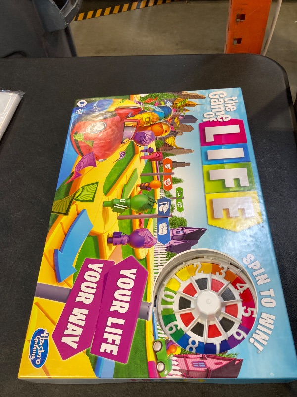 Photo 1 of The Game of Life Game, Family Board Game for 2-4 Players, Indoor Game for Kids Ages 8 and Up, Pegs Come in 6 Colors