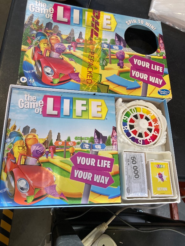 Photo 1 of The Game of Life Game, Family Board Game for 2-4 Players, Indoor Game for Kids Ages 8 and Up, Pegs Come in 6 Colors