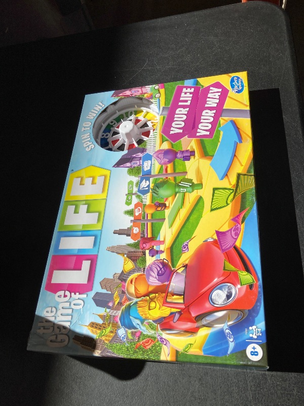 Photo 1 of The Game of Life Game, Family Board Game for 2-4 Players, Indoor Game for Kids Ages 8 and Up, Pegs Come in 6 Colors