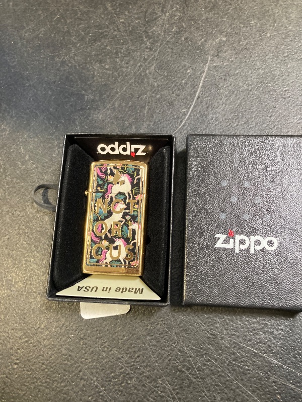 Photo 1 of Zippo Notorious Unicorn Design Pocket Lighter, Slim High Polish Brass, One Size