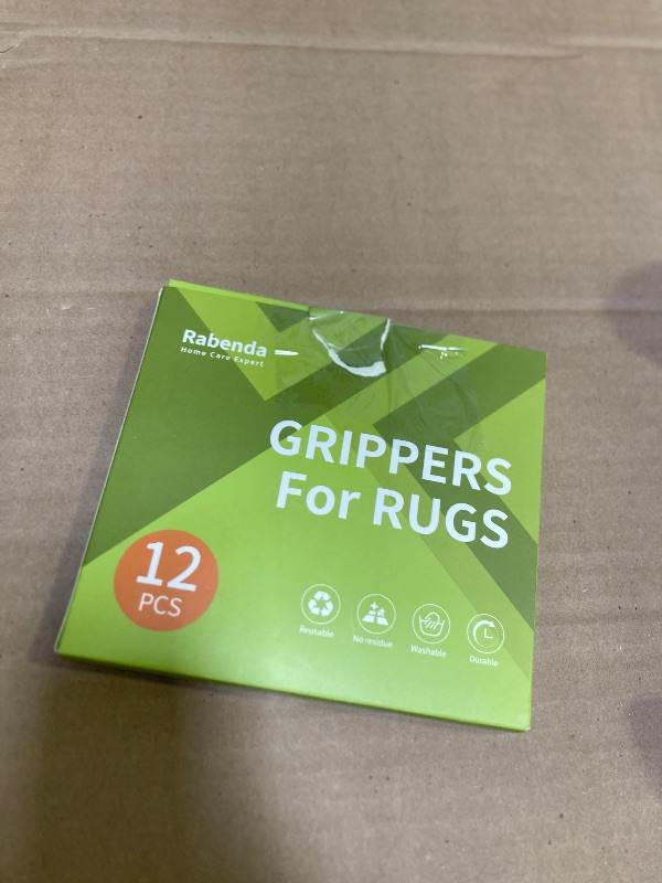 Photo 1 of Rabenda 12 Pcs Rug Tape, Non Slip Rug Pads Grippers for Hardwood Floors and Tiles, Reusable Carpet Tape for Area Rugs, Double-Sided Adhesive Rug Stickers Keep Corners Flat (Black)