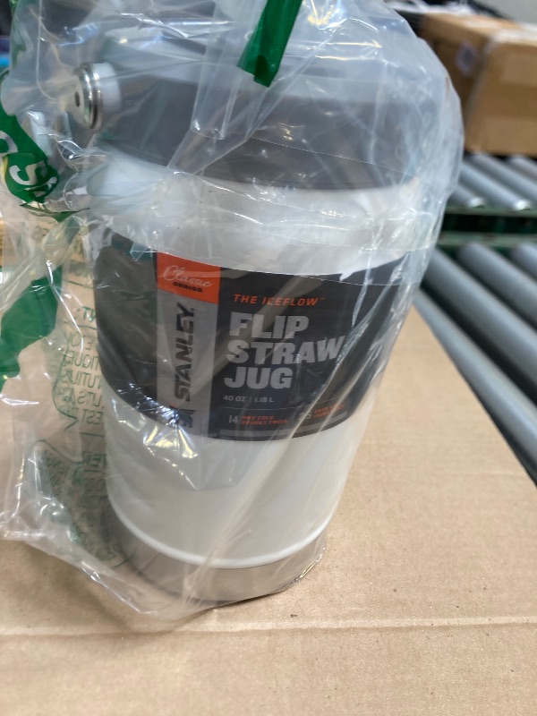 Photo 1 of Stanley IceFlow Flip Straw Jug with Handle 40 oz| Twist On Lid and Flip Up Straw | Leak Resistant for Travel and Sports | Insulated Stainless Steel | BPA-Free | Polar