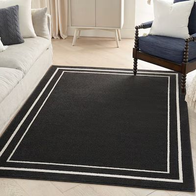 Photo 1 of Nourison Essentials 6 x 9 (ft) Loomed Polypropylene Black Ivory Rectangular Indoor/Outdoor Area rug