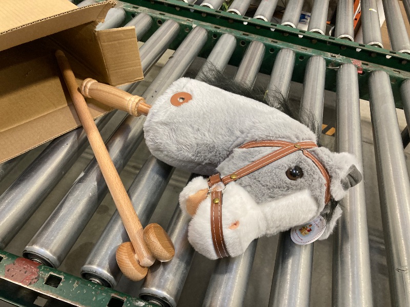 Photo 1 of HollyHOME Stick Horse Plush Handcrafted Hobby Horse on a Stick with Wood Wheels Real Pony Neighing and Galloping Sounds for Kids Toddlers Grey 36 Inches(AA Batteries Required)