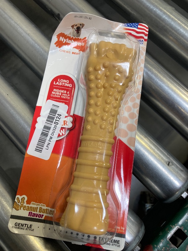 Photo 1 of Nylabone Textured Knuckle Bone Power Chew Toy for Dogs, Durable & Tough Dog Toys for Aggressive Chewers, Peanut Butter Flavor, X-Large - Over 50 Ibs, 1 Count