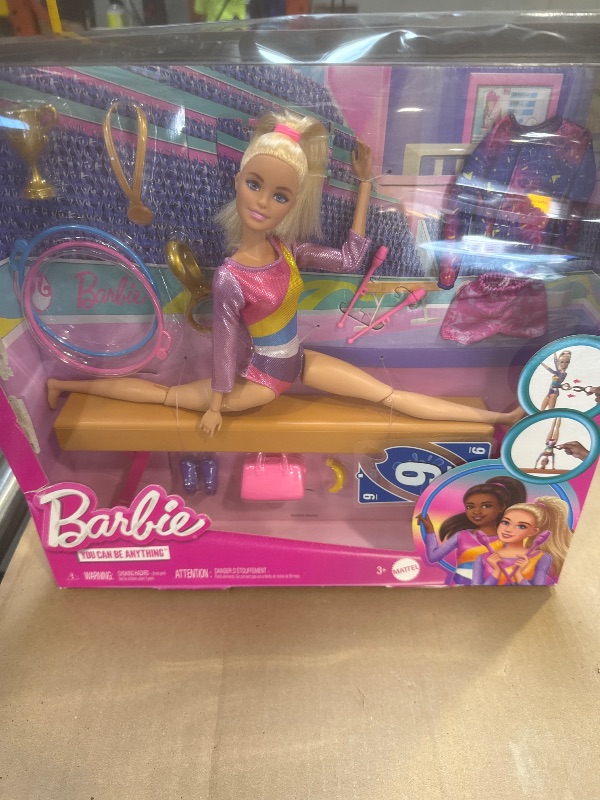 Photo 1 of Barbie Careers Playset, Gymnastics Set with Blonde Gymnast Fashion Doll, C-Clip for Flipping Action, Balance Beam, Warm-Up Suit & Accessories