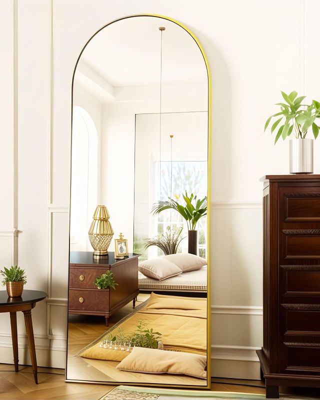 Photo 1 of Arched Full Length Floor Mirror - 59"x18" Gold Standing Mirror for Bedroom, Living Room, or Dressing Area - Stylish Arch Design, Freestanding or Wall-Mounted, Durable & Elegant

