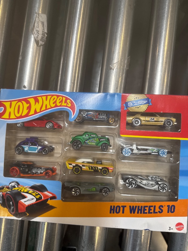 Photo 1 of Hot Wheels Toy Cars & Trucks 10-Pack, Set of 10 1:64 Scale Vehicles, Includes Race Cars, Semi, Rescue or Construction Trucks (Styles May Vary)