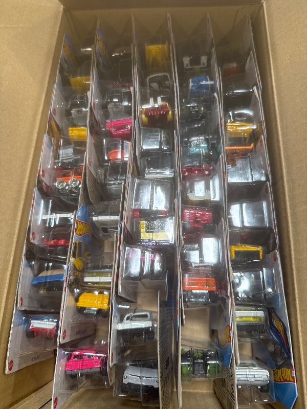 Photo 1 of Hot Wheels Toy Trucks & Cars, 50-Pack, Set of 50 1:64 Scale Individually Packaged Vehicles, Instant Collection (Styles May Vary) (Amazon Exclusive)