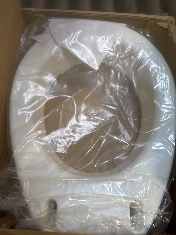 Photo 1 of Carex Toilet Seat Riser, Round Raised Toilet Seat Adds 3.5 inches to Toilet Height, for Assistance Bending or Sitting, 300 Pound Weight Capacity Toilet Riser