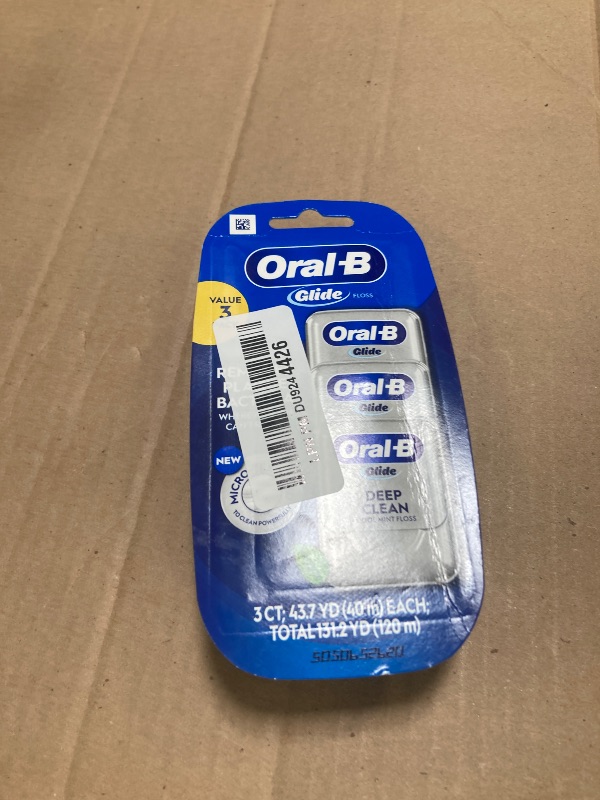 Photo 1 of Oral-B Glide Dental Floss, Shred Resistant, Gentle on Gums, Natural Wax, Slides Smoothly, Deep Clean Cool Mint Flavor, 40 M, 3 Count
