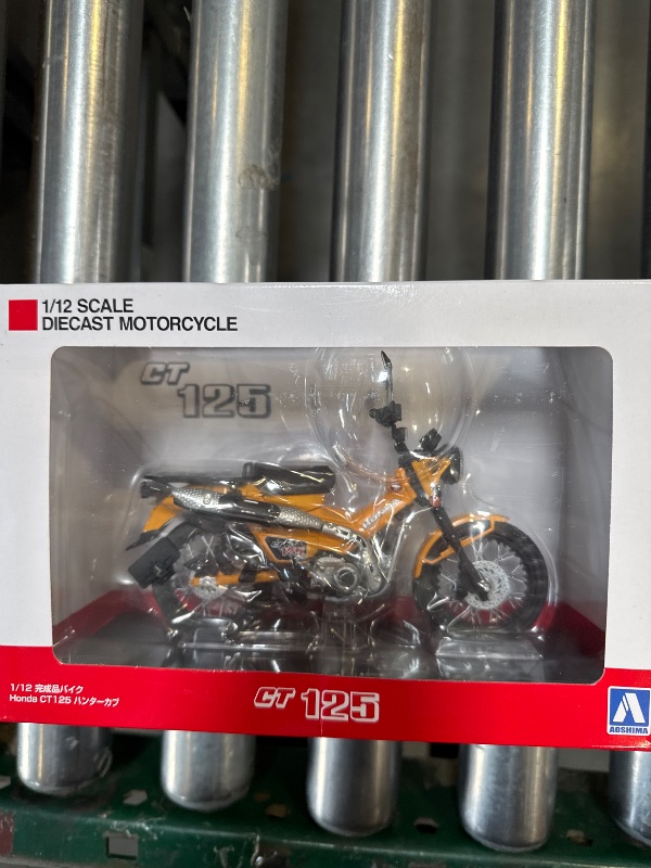 Photo 1 of Aoshima Honda CT125 Hunter Cub Tumeric Yellow 1:12 Scale Diecast Bike