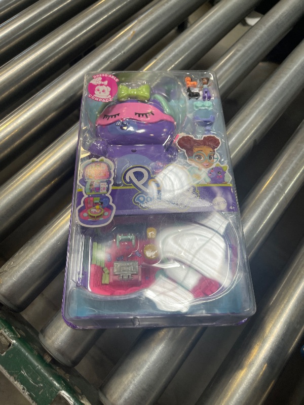Photo 1 of Polly Pocket Dolls and Playset, Sleepover Puppy Compact, Travel Toy with 1 Micro Doll, Pet Dogs, Food & Fashion Styling Accessories