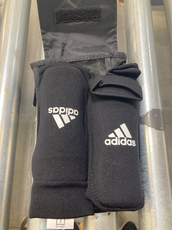 Photo 1 of adidas Unisex-Child Performance Youth Sock Shin Guards, Black/White, Medium