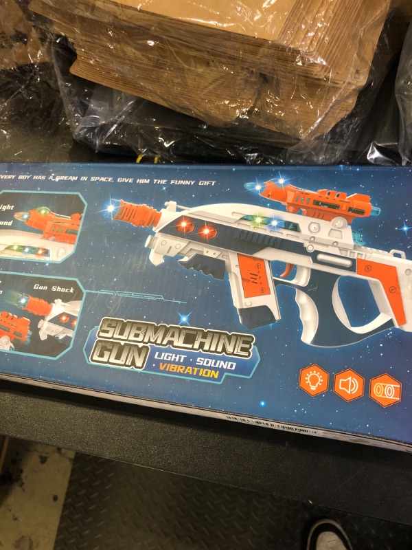 Photo 1 of Tcxomino Light Up Toy Gun with Sound Effects for Kids, Unique Shaking Planes & Barrel Telescopic Action, Baby Toy Guns Make Noise, Christmas Birthday Gifts for Boys Girls (Batteries Not Included)