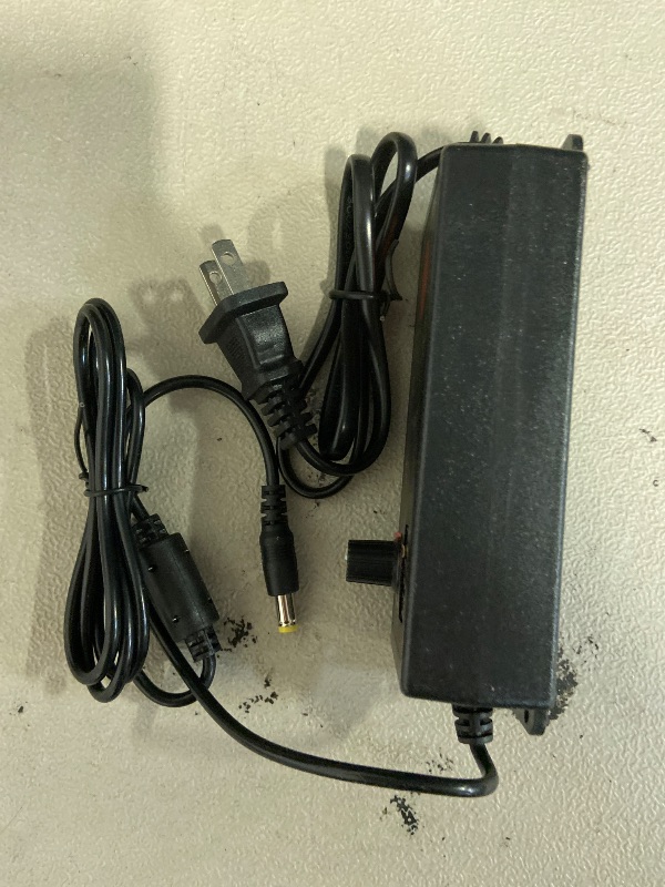 Photo 1 of AC-DC Adapter, HGJI AC-DC Switching Power Supply Charger Adjustable 100-240V to 3.3-24.7V 2.5A 50-60hz 60W with LED Voltage display US plug+Control Switch+8pcs Conversion Head+DC Alligator Clip Cable