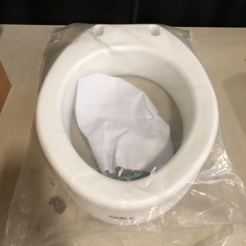 Photo 1 of Carex Toilet Seat Riser, Elongated Raised Toilet Seat Adds 3.5 inches to Toilet Height, for Assistance Bending or Sitting, 300 Pound Weight Capacity Toilet Riser