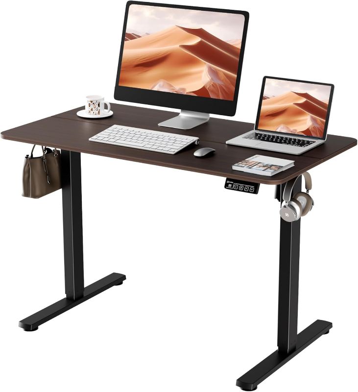 Photo 1 of Electric Standing Desk, 43.3" x 23.6" Height Adjustable Sit Stand Desk with Splice Board for Home Office, Computer Desk Memory Preset (Black Frame, Walnut Desktop)